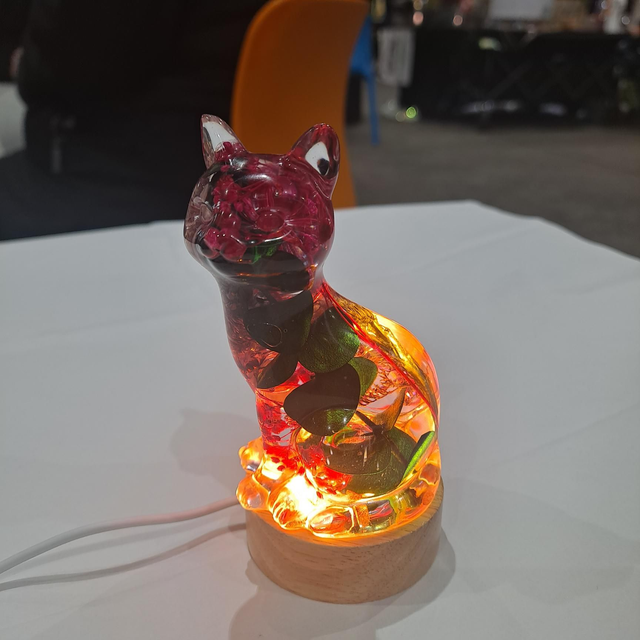 Pink and green flower cat