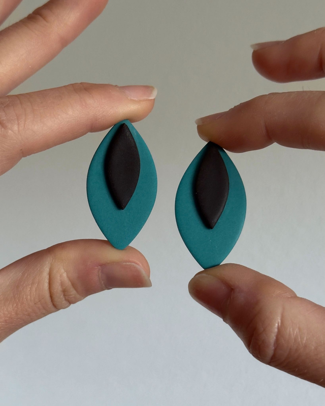 Candela teal y negro