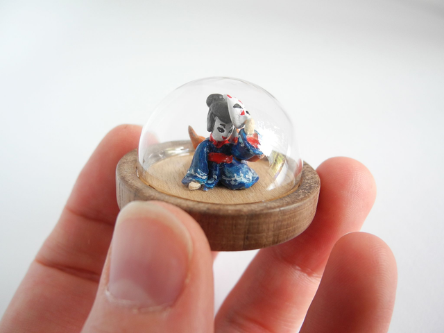 Kitsune disguised as Geisha in a Kimono adorned with waves - miniature pendant for Japan enthusiasts