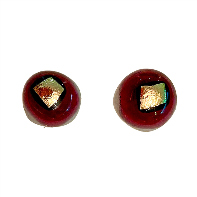 Stud earrings with a white background and dark burgundy and silvery gold dichroic glass on top (Ref ESS5 )
