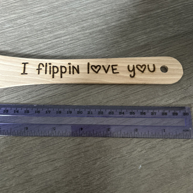 Wooden kitchen spatula engraved 'I flipping love you'