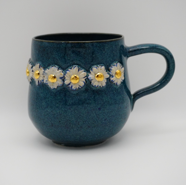 Daisy i blå med guld