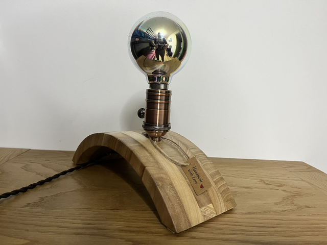 Stylish decorative lamp made of Paulownia wood with a 3D light bulb.