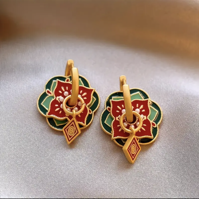Triple charmed earrings