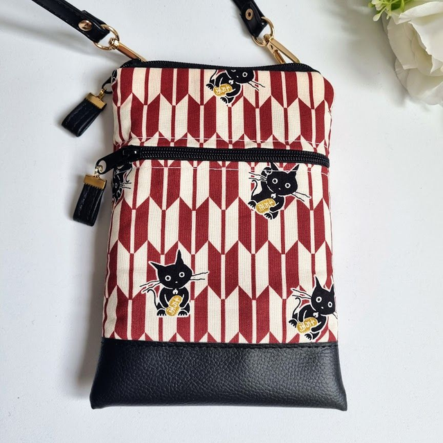 Mini-sac pour téléphone "Maneki" blanc noir & simili cuir noir