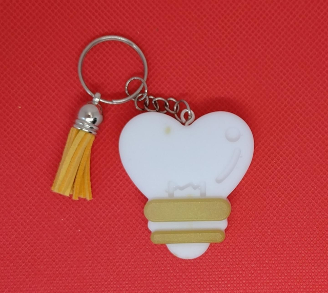 Porte clés doré et blanc 