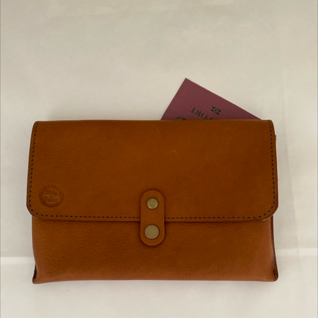 Tan leather travel pouch