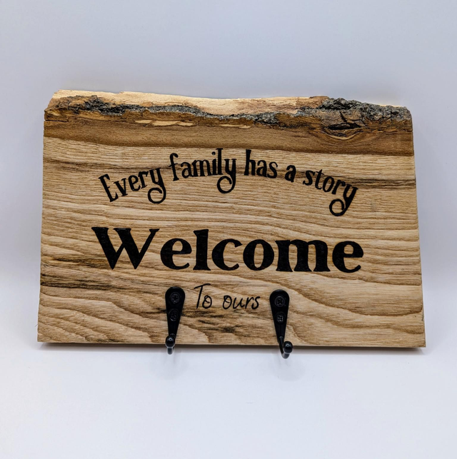 'Every family has a story' Key holder. 