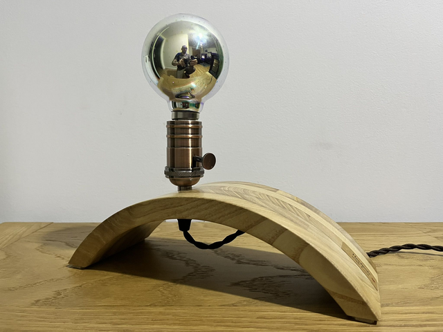 Decorative lamp made of Paulownia wood with a 3D light bulb.