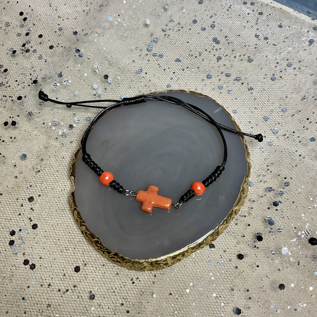 Adjustable bracelet with quartz cross. Fully adjustable cord bracelet.