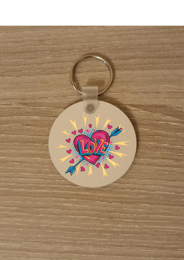 Porte clé cœur rose fléche bleu