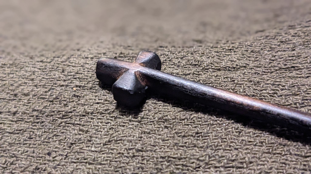 Black hardwood cruciform pin