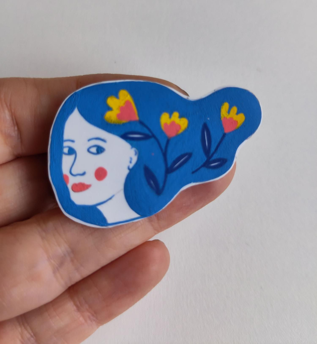 Broche "haren in de wind"