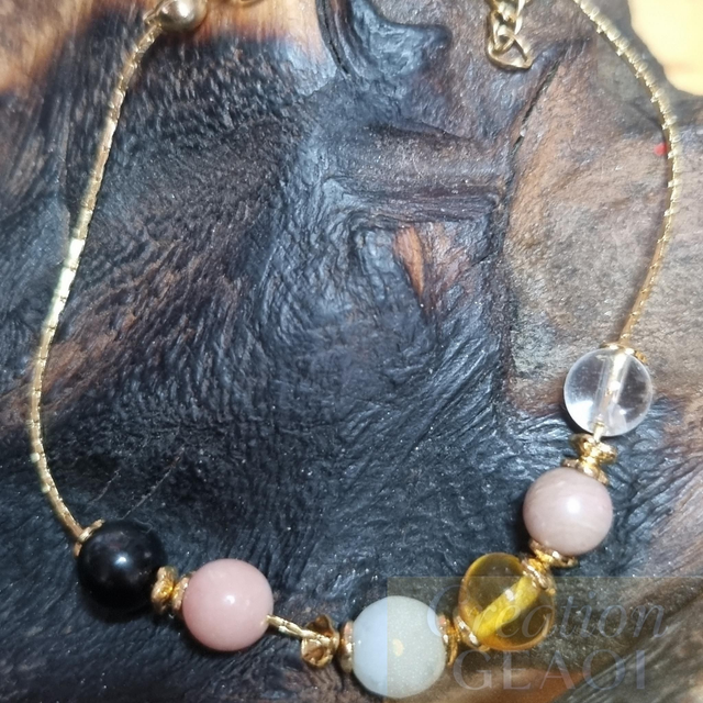 Bracelet des êtres chers (obsidienne noire, Opale Rose, emeraude, ambre,rhodocrosite, cristal de roche