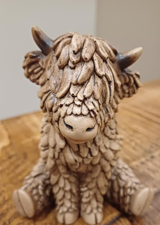 Sitting Highland Cow 