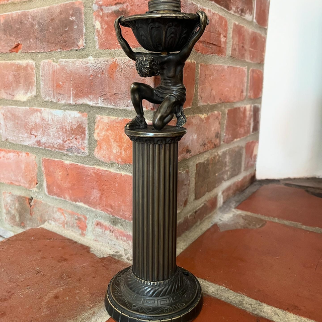 A Bronzed Metal Table Lamp Of Atlas