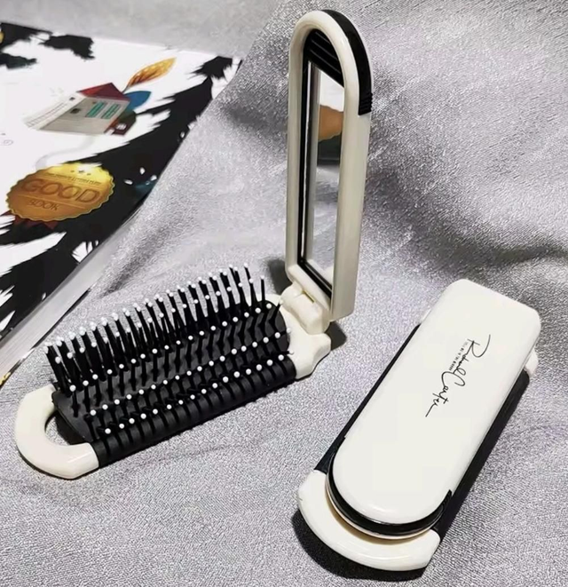 Cepillo plegable con espejo