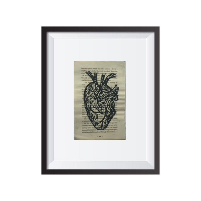 Heart print on book page linocut