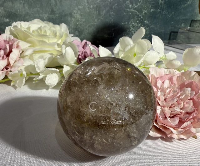 Rainbow filled Smokey quartz sphere