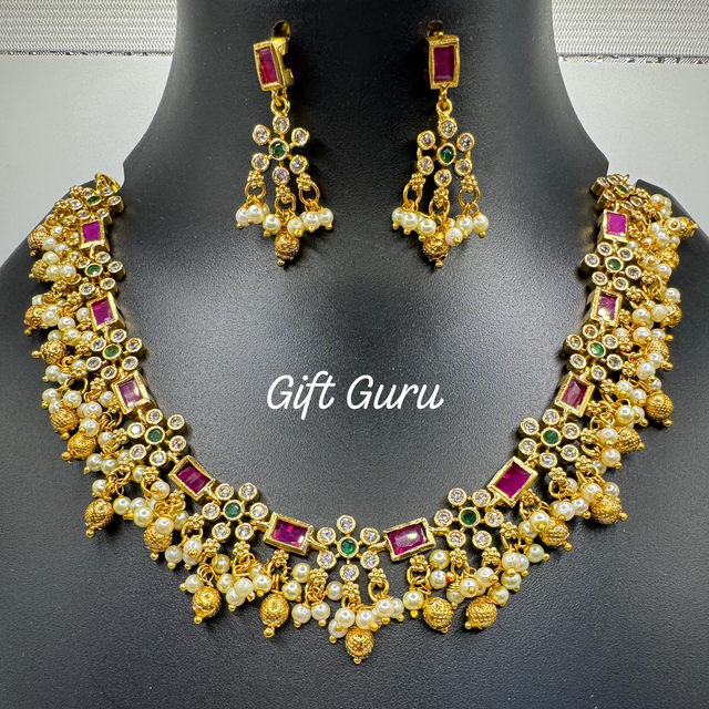 Temple necklace with ear rings 