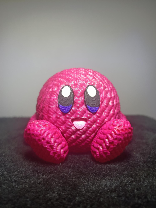 Figurine tricoté rose nacré 