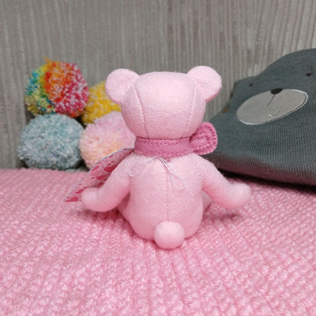 Alice. Small size, handmade teddy bear. UKCA. Tray base packaging. Standard Wool Felt. Baby pink. Cherry Blossom pink. Blush. White.