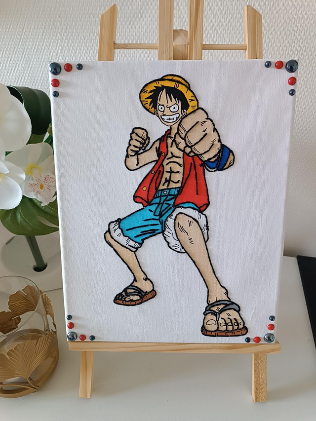 Toile brodée personnage L