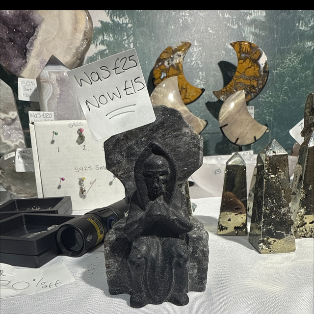 Obsidian grim reaper on lavakite chair