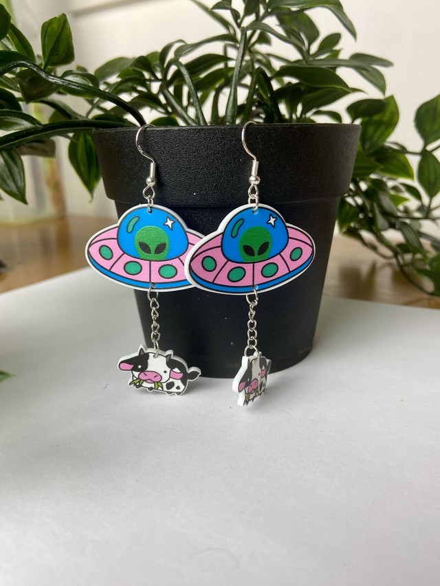 Alien cow abduction earrings.
