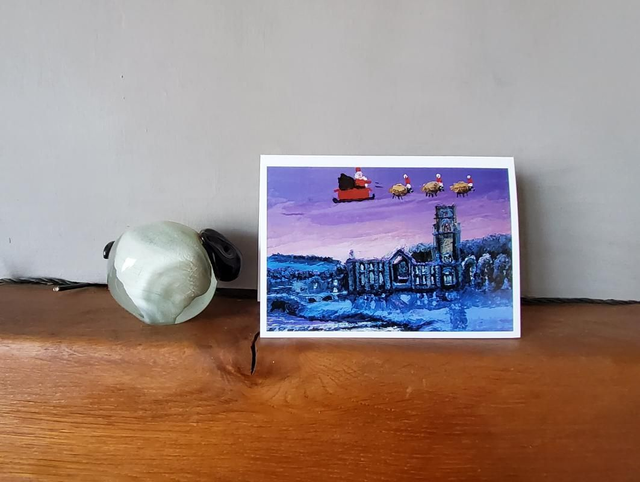 Father Christmas and his flying sheep over Fountains Abbey. A6 Christmas card. 