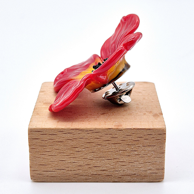 Pin's Fleur rouge et jaune